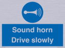 sound-horn-drive-slowly-warehousing-and-delivery-sign~